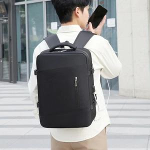 Close-up of black business laptop backpack with USB charging port and padded shoulder straps