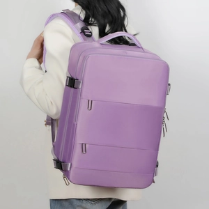 Lavender purple travel backpack with wide padded straps shown on a model back view