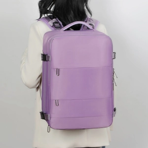 Detail of lavender travel backpack featuring adjustable side straps and metal zippers