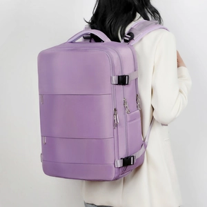 Lavender purple travel backpack with adjustable side buckles shown on model for scale