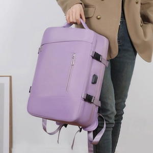 Detail of travel backpack with side buckle, USB charging port and padded handle