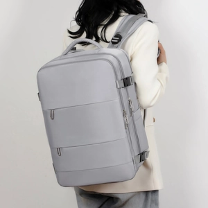 Detail view of large capacity travel backpack with ergonomic straps and nylon texture