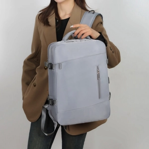 Detail view of water-resistant nylon business backpack with side buckle and top handle