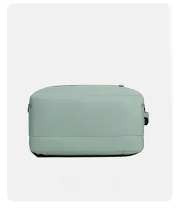 Detailed bottom view of large mint green travel backpack showing durable nylon texture