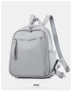 Detailopname van het premium grijze PU-leer met lychee-patroon en de metalen rits