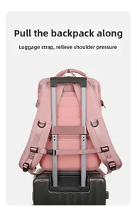 Pink travel backpack featuring luggage strap design for secure attachment to suitcase handles