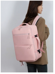 Detail of pink waterproof travel backpack with side buckle and reinforced handle