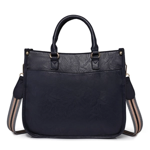 Gros plan du sac à main rétro bleu marine avec texture grainée et bandoulière rayée