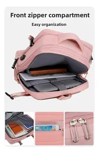 Detail view of pink business backpack interior with multi-layer laptop storage compartments