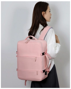 Pink large capacity travel backpack side view with durable handle and buckle detail