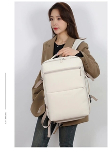 Detailed side view of a creamy white leather backpack featuring secure side buckle straps