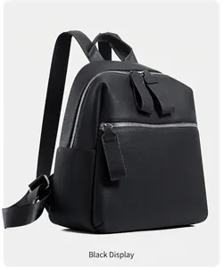 Side view detail of black lychee grain faux leather backpack with silver zippers