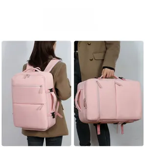 Pink travel backpack showing dual carrying modes with shoulder straps and side handle