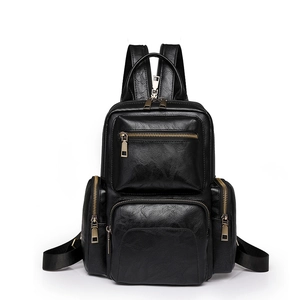 Classic black PU leather backpack for women featuring multiple zip pockets and vintage hardware