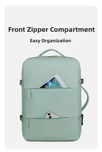 Detail of mint green laptop backpack featuring dual front zipper storage compartments