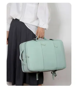 Detail of mint green travel backpack with padded handles and multifunctional straps