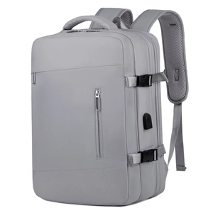 Expandable light gray business laptop backpack with USB port and waterproof fabric