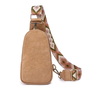 Fashionable camel faux leather sling bag with bohemian woven shoulder strap and metal clips