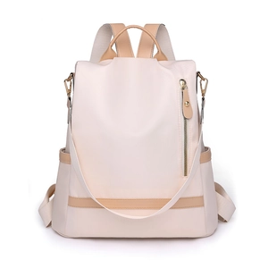 Minimalist cream nylon backpack for women with brown faux leather trim and vertical pocket