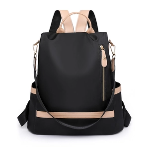 Minimalist black waterproof nylon women's backpack with contrasting beige leather trim