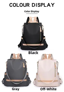 Three-color display of nylon backpacks in black, grey, and beige with leather handles