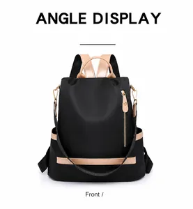 Front view of a black nylon backpack featuring elegant beige leather trim details
