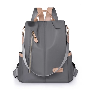 Minimalist large capacity nylon backpack for women in dark gray with brown leather trim