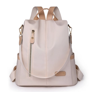 Minimalist beige nylon backpack with khaki leather accents and gold hardware for women