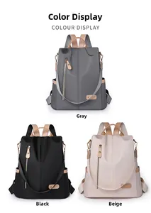 Detailed view of large nylon backpacks in grey, black and beige with leather accents