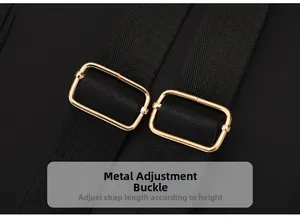 Close-up of golden metal adjustment buckles and nylon straps on a black backpack