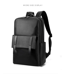 Détail d'un sac à dos d'affaires noir montrant la poche à rabat et la poche latérale