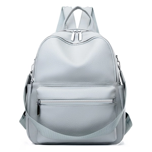 Detail of light grey PU leather backpack showing lychee texture and silver metal zippers