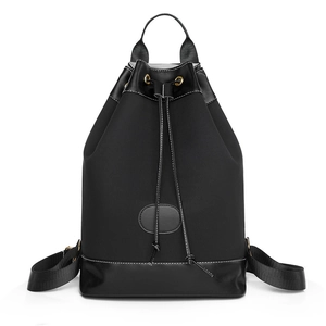 Black Oxford cloth backpack with leather details and drawstring for commuting and travel
