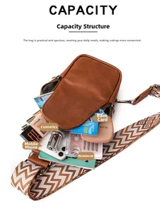 Detailed internal capacity of brown pebbled leather crossbody bag with items and strap