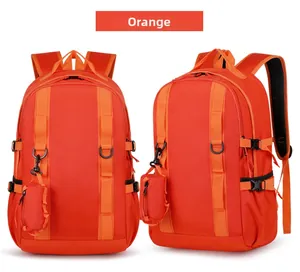 Detail of orange hiking backpack showing functional straps and small zipper pouch attachment