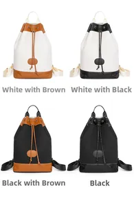 Four colors of Oxford fabric bucket backpacks with contrasting synthetic leather trim details