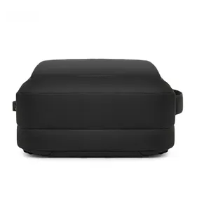 Detail view of the durable fabric bottom and external USB charging port on the black backpack