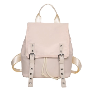 Large pale pink nylon backpack with decorative silver studs and drawstring closure