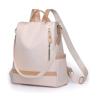 Minimalist beige nylon backpack for women with brown leather trim and multi-way straps