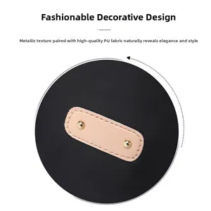 Detailed close-up of premium PU leather patch with golden metal rivets on black nylon bag