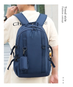 Detail of waterproof nylon backpack with adjustable D-ring straps and side coin pouch