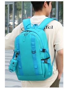 Detail of bright blue waterproof nylon hiking backpack featuring a matching mini pouch