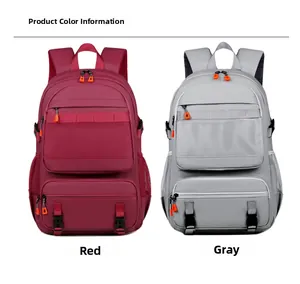 Detail view of large outdoor backpacks in red and gray with multi-pocket storage and mesh pockets