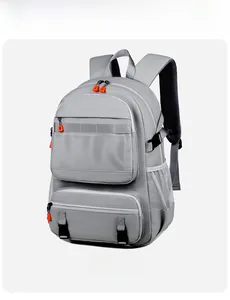 Detail view of gray hiking backpack featuring bright orange zippers and mesh pockets