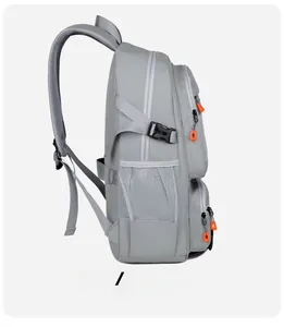 Detailed side view of the grey travel backpack with mesh pocket and orange zipper pullers