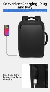 Detail of waterproof business backpack showing external USB charging port with phone connection