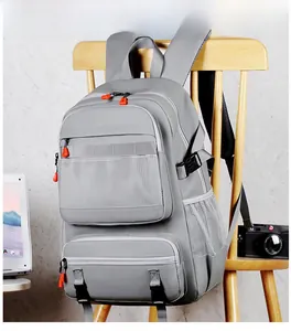 Detail of gray travel backpack with orange accents shown in a digital workspace