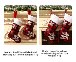 Size chart for red and black plaid Christmas stockings with white snowflake patterns