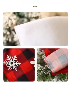 Detail of red and black buffalo plaid Christmas stocking with white snowflake print