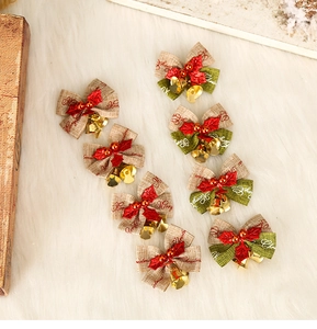 Detail view of 8pcs Christmas linen bows with red leaves, golden bells and Merry Christmas print